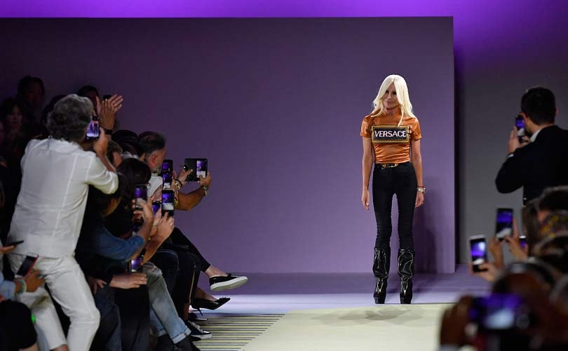 michael kors merger with versace